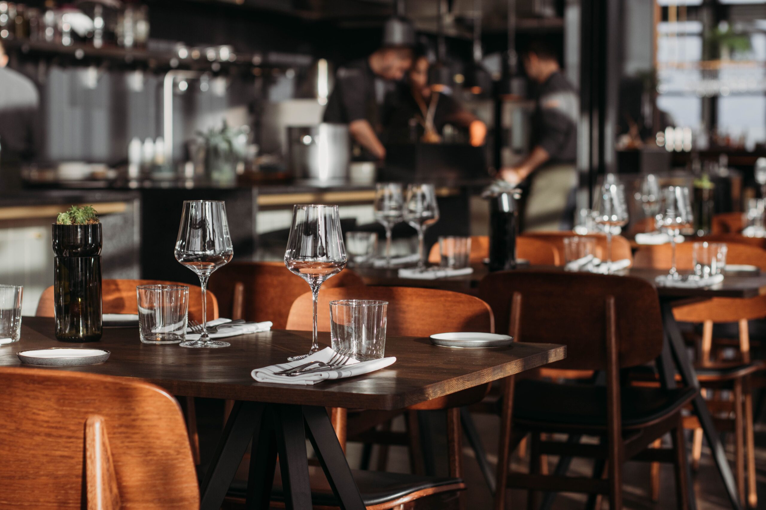 Modern, upscale restaurant interior with ambient lighting, highlighting Visionary MPR hospitality marketing and PR services.